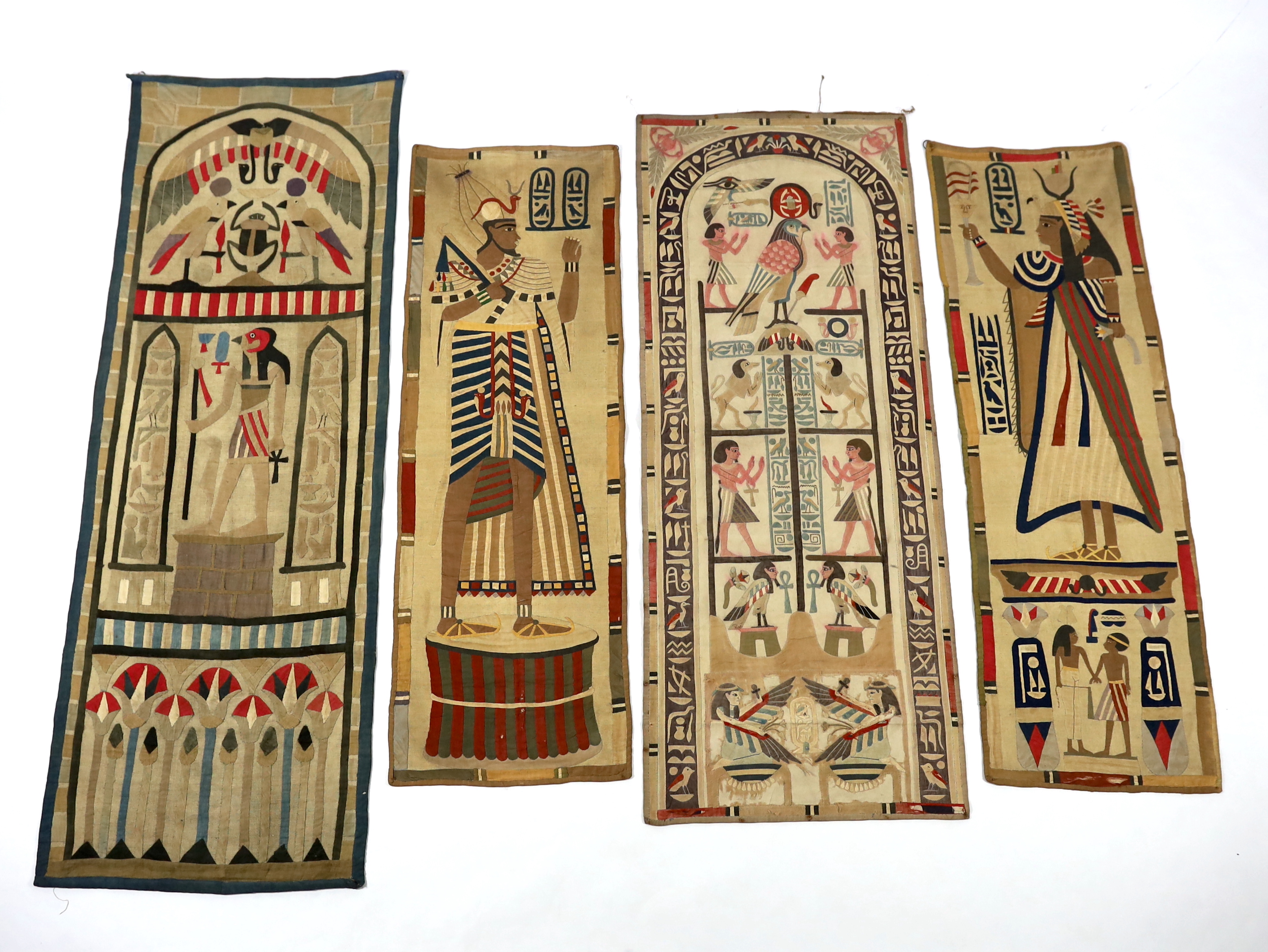 Four 1930’s Egyptian appliqué wall panels, (a pair and two single panels), decorated with various hieroglyphs, Gods and Pharaohs, the panels made for the European market experiencing an Egyptian revival after the discove